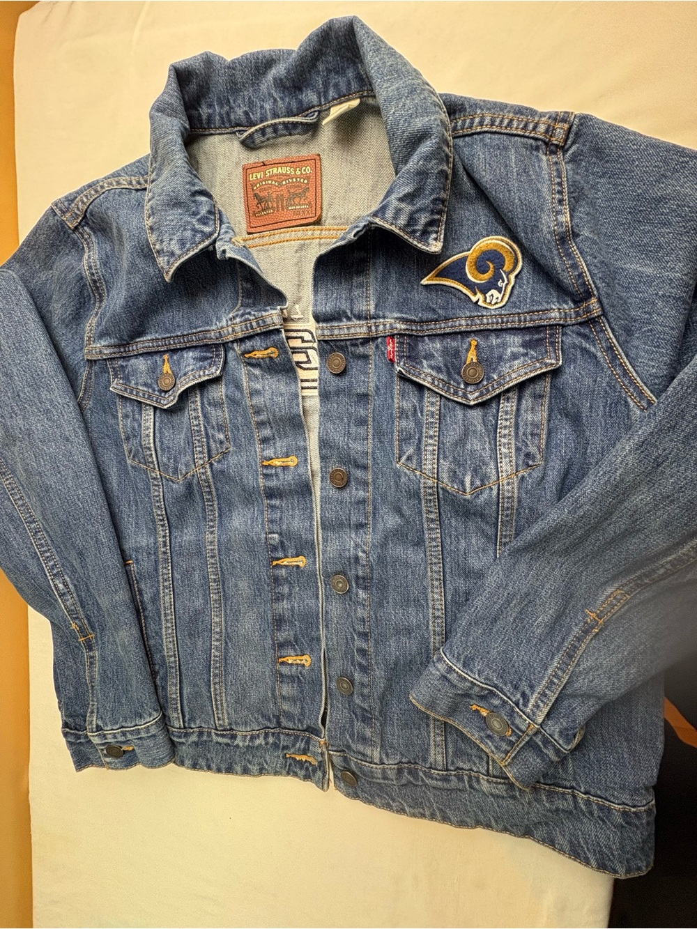 Levi's Blue Denim Trucker Jacket with Rams Patch
